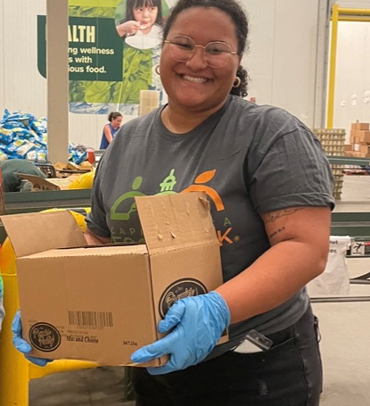 Intern Kayla Tingley-Renaudin (from The Catholic University of America) working at Capital Area Food Bank.