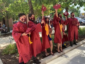 Six graduates celebrate.