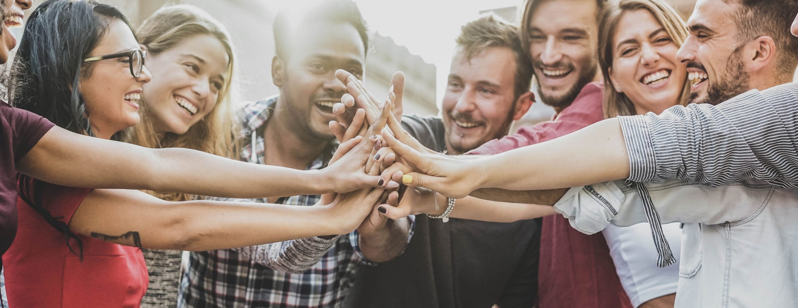 Group of people joining hands